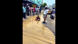 Hyderabad woman protests damaged roads by sitting in stagnant water at Nagole area
