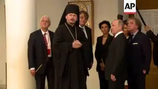 Putin visits Russian orthodox church in Paris
