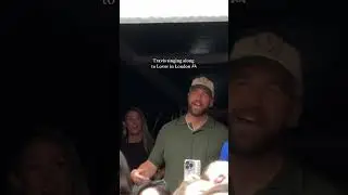 Travis Kelce wearing a #TeamUSA cap, singing Lover at Taylor Swift concert. 📹: raeannlangas