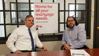 Local Realtor discusses loan services with Greg Allen at KeyBank in Glastonbury