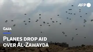 Parachutes fall during aid airdrop over the central Gaza Strip | AFP