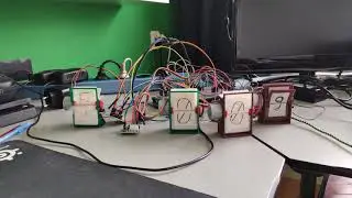 3d printed split flap clock showing time and temperature