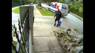 Watch this FedEx Guy Throw Flat Panel TV over the fence