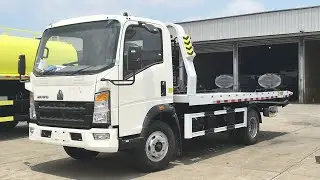 Howo light duty RHD flat bed towing wrecker