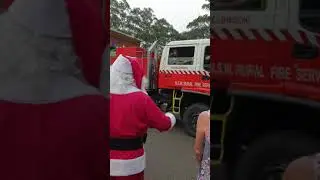 Santa wishing a safe and good trip to a NSW RFS Crew