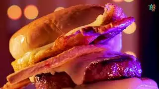 Neon Burger Sign Glowing on Dark Brick Wall Animated Particles Background Food Restaurant Cafe