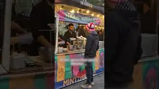 Far-right protesters queuing at food stalls they oppose