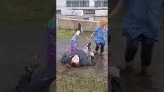 Mom slips in rain puddle... 🤣 #shorts #water #fall