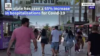 Unmasked Floridians crowd Miami beach as Delta variant spreads through US state