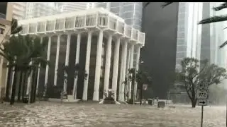 Storm surge and high winds hit downtown Miami
