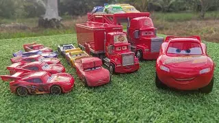 Lots of Cars! Various miniature Disney cars fall in the water