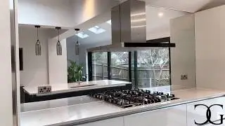 Modern White Wren Kitchen and Large Feature Mirror Splashback by ®Creoglass,  www.creoglass.co.uk