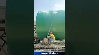 Fiberglass tank manufacturing with a machine: people creating fiberglass tanks with a machine