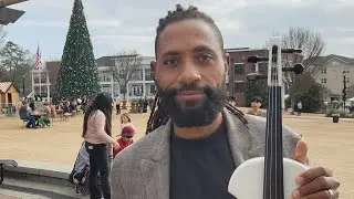 Violin music at Christkindl Market. Joseph E. Reed, The One Man Orchestra is live! 12-24-25