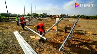 The installation process o real life photovoltaic solar panels on the ground