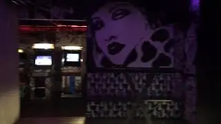 Inside black light bar and Detroit-themed arcade at Deluxx Fluxx