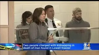 Two people charged with kidnapping after man found dead in Lowell freezer