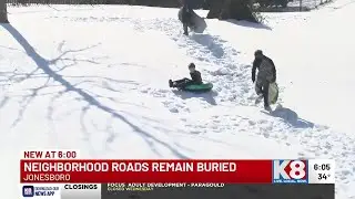 Neighborhoods remain buried under snow as residents make the most of winter days