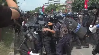 Protesters in Nepal surround parliament and clash with police as government blocks social media