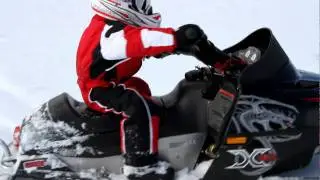 3 year old Mark riding his snowmobile 1
