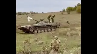 Russian troops fix white flag to tank and surrender to Ukrainian soldiers