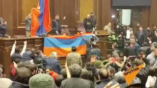 Chaos in the Armenian Parliament after protesters entered the meeting room