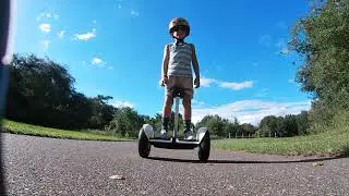 5 year old kid riding a Segway Ninebot S