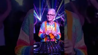 Grandma DJs a rave, knitting while mixing #trending #2026 #reel #viraltrend #whatstrending