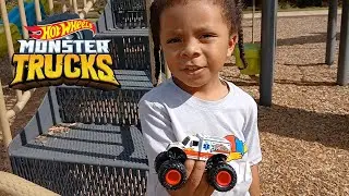 Elias plays with Hot Wheels Monster Truck Jambulance at the park