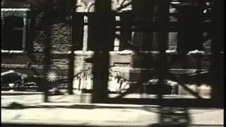 Damaged buildings and a rail car on tracks in Tokyo, Japan during World War II. HD Stock Footage