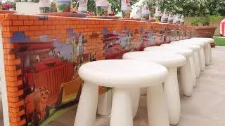 Kid's Table and Stools with Plate, Cups and Juice