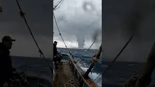 Giant Waterspout Forms Directly in Front of Fishing Boat