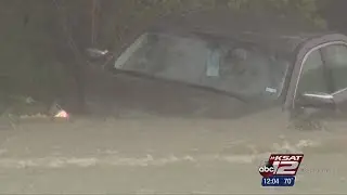 Video: Passing drivers rescue woman from high water