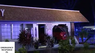 Two vehicle crash causes van to crash into building St. Cloud FL