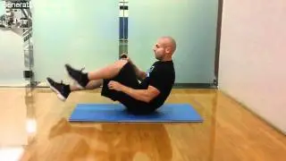 Workout Library - V-Sit Figure 8 with Dumbbell - www.workoutlibrary.com
