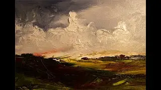 Jon Kidd painting a landscape in oils on A3 canvas paper.