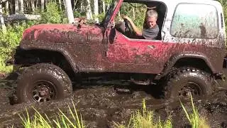 4 cylinder jeep in deep mud