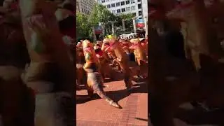 Inflated dinosaurs dancing in Portland&rsquo;s Pioneer Square