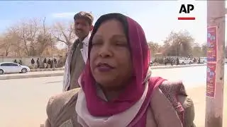 Injured helped after suicide bombers attack church in Pakistan