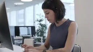 Young Female Clerk Typing on Computer | Stock Footage - Videohive