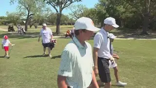 Jordan Spieth plays with young children at Brookhaven Country Club