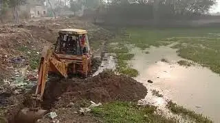 Ace backhoe loader working in water (Old machine..... but advance features)