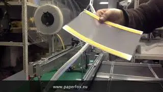 Klebebandapplikation auf transparente Folie mit einem Paperfox FTD-1-Klebebandapplikator.