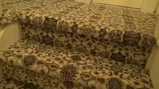 Custom installation of a print carpet on steps and hall with a matching area rug