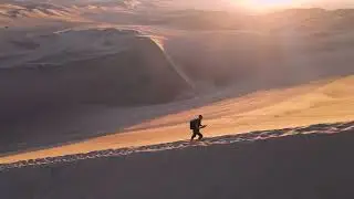 Sunrise Hike Across Vast Desert Dunes
