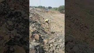 Stone pitching work on road side river