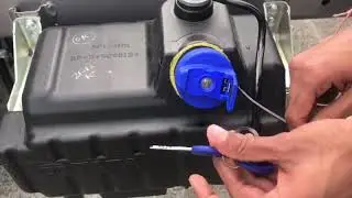 Def tank cap removal & locking.