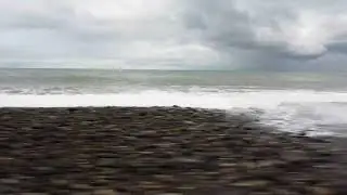 Rhythmic Waves on the Smooth Pebble Shore 🌊🪨
