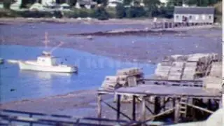 1964: Empty fishing crab traps on dock piers ready for hunting season. PORTLAND, MAINE
