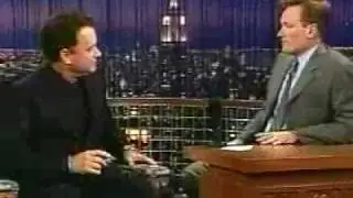 Conan gives Tom Hanks a painting